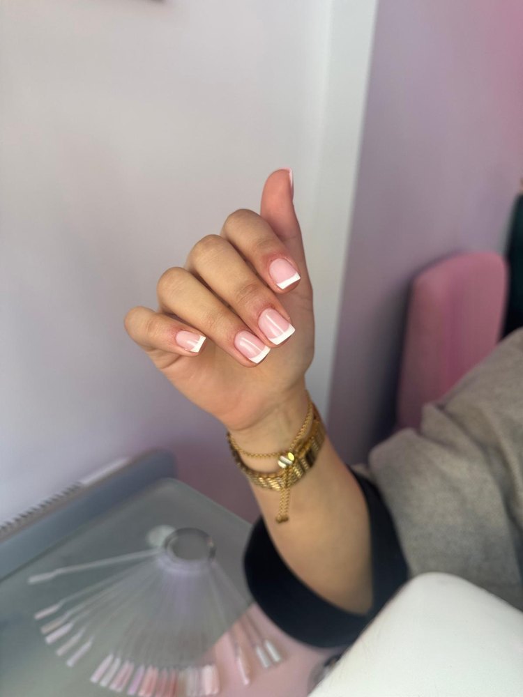 Red gel nails with clean cuticle line — Nata Beauty, Bristol